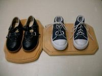 Montessori Teacher: buckle and tie shoes nailed to wood plaques for practice