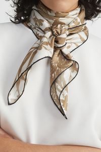 This square scarf is masterfully crafted in Italy on fluid silk and graphically renders the collection's eco print-inspired fern motif. It's cut in a versatile shape with artisanal hand-rolled edges.INSIDE THE ECO PRINTL148’s resident artist turned to the natural technique of eco-printing to create Spring 2024’s flora artwork, applying and steaming foliage transferring their forms and textures to paper. These imprints were then translated into the collection's many motifs.