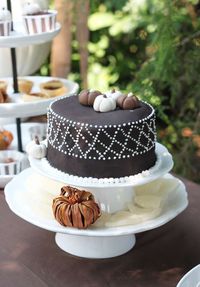 Pumpkin topped chocolate cake at a Thanksgiving party! See more party planning ideas at CatchMyParty.com!