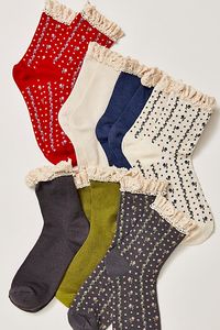 A necessary addition to your sock drawer, this so essential pack features 7 pairs of ultra-soft socks in an ankle-height with feminine ruffled trim, waffle knit details, and dainty floral prints. * 7 pairs of socks * Seamed heel + toe | The Ultimate Sock Pack at Free People in Roadhouse