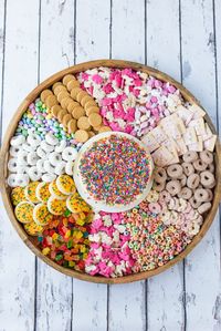 This Epic FUNFETTI® Inspired Cake Board is for any birthday celebration, a large dessert board with funfetti cake and treats with bright colored sprinkles!  #funfetticake #epicboard #dessertboard #birthdaypartyideas