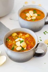 Manhattan Clam Chowder is a delicious tomato-based clam chowder loaded with clams and vegetables, and served with oyster crackers on top!