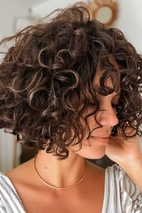 Choose the textured perm for a modern look to add edginess to your hairstyle. This style is characterized by its varied curl sizes and textures, creating a contemporary and dynamic appearance. Click here to check out more best perm hairstyles for natural looking curly hair.