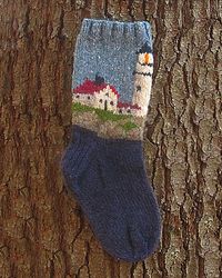 Try your hand at some fun landscape colorwork with our Lighthouse Socks! The chart is easy to read, and you'll get to use some fun colors. As this is a vintage pattern, many of the colors are gone, but we've got some great substitutions in the yarn list below. Difficulty: 3/5 Finished Measurements Adult Women (Men) Yar