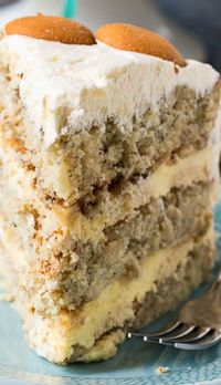 Banana Pudding Cake Recipe ~ A layer cake with all the flavor of banana pudding. Between the layers is a creamy banana pudding filling with Nilla wafers and fresh banana slices. The cake is covered in a delectable whipped topping frosting