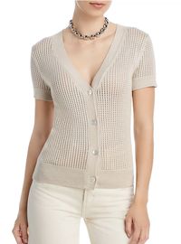 Add a touch of elegance to your wardrobe with the T Tahari Short Sleeve Pointelle Cardigan. This stunning piece is available in Tan Palm and features a fitted silhouette, V-neckline, front button closures, and short sleeves. Made with a pointelle knit design, it's perfect for layering over any outfit. Bloomingdale's affiliate.