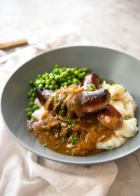 Sausage with Gravy - affectionately known as "Bangers and Mash" - with a killer gravy. Simple to make from scratch, video included, a 20 minute dinner!