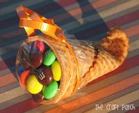 Must remember for Thanksgiving next year! Dip tip of waffle cone in warm water for about 20 seconds then microwave for 20 seconds.  Roll the softened end of the cone around a clean pencil then hold in place for 20 seconds. Little cornucopias.