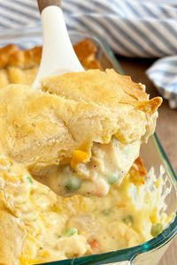 This Chicken Pot Pie Casserole with crescent rolls is an easy chicken pot pie recipe with rotisserie chicken and cream of chicken soup under a crescent roll crust. Your entire family will love this easy recipe, and it's a great way to use up leftover chicken!