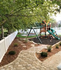 Stone path from garage to firepit