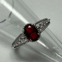 Oval 8x6mm Lab Created Ruby * Sterling Silver * Rhodium Plated * Lead N Nickel Free * Color May Vary.