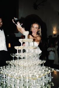 bride, champagne, champagne tower, wedding trend, tux, bridal style, anti bride, wedding trends, 2023 weddings. stylish, weddingideas, fashion.