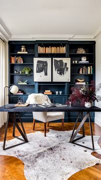 This clean,  timeless design uses our deep, blue Espionage (C2-742) as an accent wall that’s both eye-catching and functional as a bookshelf in this home office. Perfect for a part-time spy. #decor #home #blue #inspiration #decorating #office #accentwall #bookshelf