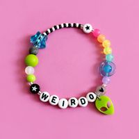 Personalise with any name or word. Rainbow space themed bracelet featuring the cutest laser cut acrylic alien charm on a stainless steel jump ring.  Silicone bead, planet bead and sliding star add an extra sensory tactile detail to this bracelet.  Choose from the size options at checkout.