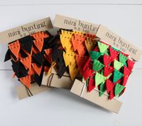 Set of three fall and winter holiday mini bunting garlands include: one Halloween garland in orange and black, one Thanksgiving garland in gold, orange, goldenrod and dark brown, and one Christmas garland in red and three shades of green. Add a sweet festive touch to your home with this adorable mini bunting. They look great draped over a mirror, window frame, mantle, right on the wall or anywhere else you need a little bit of cheer!  The hand-cut flags are made of eco-felt {made from recycled water bottles} and measure about 1 inch tall. They were lovingly strung on perle cotton embroidery floss, knotted on each end. The flags slide freely along the floss, so if you'd like to cut smaller lengths of garland, the flags and floss will easily adjust. Each garland is 8 feet long with 12+ inche