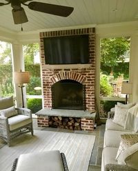 On this screened porch, the fireplace area is designed for maximum comfort. “We did the fireplace, and the brick mason did that log niche for them,” says William. “It’s great to have — easy, close access to the wood, and it keeps it dry.”