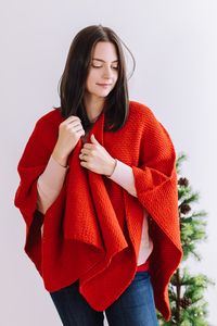 With its relaxed design and straightforward construction, this Winterberry Red Ruana is the ideal project for crocheters seeking both ease and artistic expression. The easy-going nature of the pattern ensures a satisfying and enjoyable crocheting experience, making it a perfect choice for crocheters of all levels.