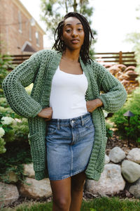 Hey there, fellow fall-lover! Meet your new favorite layer – the Sage Cardigan! This super cozy Tunisian crochet wonder is the perfect companion for all of your pumpkin-spiced escapades. You’ll love how lightweight it is, and the inset pockets are great for keeping your hands warm on a stroll through the apple orchard. It’s a thoughtful addition to a casual outfit when you want to look cute without sacrificing comfort. But be warned – you may never want to take it off!