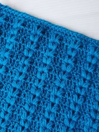 Today you will learn the Harvest Crochet Stitch. This easy crochet stitch pattern features rows of stacked puff stitch v-stitches that remind me of the head of a stalk of wheat. This crochet stitch would