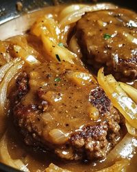 Enjoy this hearty Hamburger Steaks with Onion Gravy recipe. Juicy beef patties with rich gravy, perfect for a quick and delicious dinner.