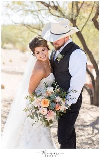 Bride and groom show off a hint of rustic country with his cowboy hat and her boots on their wedding day!