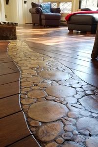 In this article, we go over what we did to create this wood slice accent flooring. Otherwise known as end grain flooring, log end flooring or end grain log flooring.  Whatever name you prefer, we think the end result looks really nice!