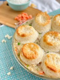 Easy biscuit chicken pot pie recipe that is loaded with veggies, chicken and a heavenly creamy gravy. On the table in 30 minutes!