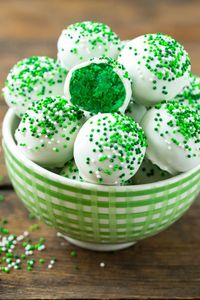 7 Must-Make St. Patrick's Day Desserts! These Luck of the Irish Cake Balls feature a surprise emerald green center for the ultimate festive treat.