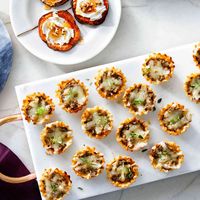 Give your guests something to talk about by serving a platter of these mushroom stuffed phyllo cups. Served with a big-batch party cocktail, these mushroom-stuffed cups are the perfect accompaniment to other favorite party appetizers.