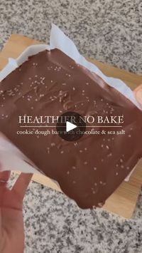 1.5K views · 3.2K reactions | NO BAKE COOKIE DOUGH BARS

Recipe here 👇🏽 

Cookie dough - combine everything together in a mixing bowl 
1 1/2 c oat flour
1/2 c creamy peanut butter
1 teaspoon vanilla extract
1/2 tsp. salt (omit if sprinkling with sea salt)
1/4 c maple syrup
1/4 c melted coconut oil 
1/2 c chocolate chips

Topping - melted together in a small bowl
3/4 c chocolate chips
2 teaspoon coconut oil

Layer the dough into a 9x5 pan lined with parchment paper. Pour the melted chocolate onto the top, giving it an even spread. Sprinkle with optional sea salt. 

Keep refrigerated or frozen. 

Credit: @caroline_mcdaniel_ 

#healthyhabits#healthylifestyle#fitnessjourney#eatwellbewell#healthydesserts#fitmom#momswhoworkout#countingmacros#easydesserts#nobakerecipes#foodisfuel#nutritioncoach