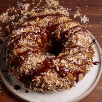 Super size your favorite Girl Scout Cookie! Get the recipe at Delish.com. #delish #easy #recipe #video #samoa #bundt #cake #dessert #caramel #toastedcoconut #parties #families #fun #sweettreats #chocolate