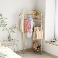 PRICES MAY VARY. Adjustable Angle: This gold metal clothing rack can be folded from 180 degrees to 90 degrees, but please note that stability cannot be guaranteed if it is used spread out to 180 degrees. This is a perfect gold freestanding coat rack for corner organizer. Multiple Roles:The gold clothes racks freestanding acts as many roles. The two hooks can hang your hats, scarves, bags, double rails are perfect for hanging your dresses, suits, coats and skirts ext. Top and bottom shelves can b