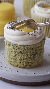 These bright Lemon Poppy Seed Cupcakes are sweet and fluffy with a lemon curd filling and cream cheese frosting. Each bite has a layer of chewy, nutty poppy seeds, sweet lemon cake, zesty lemon curd, and creamy frosting overflowing with fresh citrus flavor.