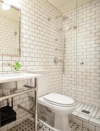 Black and White Bathroom with White Subway Tiles Accented With Black Grout - Transitional - Bathroom