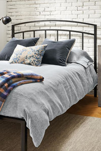 Luka is a modern steel bed with a unique arched design for the headboard. Welded in Minnesota by a family-owned company, its durable steel construction makes it extremely strong. What's more, it doesn't require a box spring; simply lay your mattress on the included slats for a low-profile modern look.​