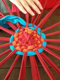 Hula Hoop T-Shirt Rug. Sounds kind of awesome. Maybe could make one while at farmer's market this summer?