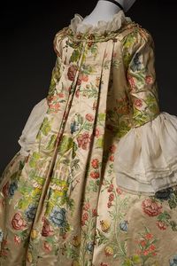 satin-weave silk (florentine); off white plain weave linen lining Woman's gown consisting of an open, robe a la francaise (sack back or Watteau) robe and a petticoat. Both are in a matching fabric of white silk satin with polychrome, brocaded chinoiserie. Pattern details include architectural structures and floral motifs.