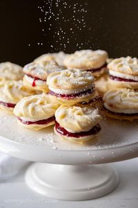 Mary Berry's Viennese Whirls - delicious, tender melt-in-your-mouth butter cookies with raspberry jam and vanilla buttercream filling. #Viennesewhirls #cookies #holidaybaking #raspberryjamcookies #buttercookies #Maryberry #whirls #christmascookies #christmasbaking #baking #cookierecipe #christmascookierecipes