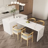 S'intégrant parfaitement à votre décoration existante, cet îlot de cuisine fera ressortir le meilleur de votre espace intérieur. Le grand plateau de table avec un motif en marbre plaqué offre un espace de travail/une étagère de présentation ouverts qui ajoutent une touche moderne exquise à votre salle à manger. Grâce à son design extensible, il se transforme en différentes formes sans effort. Les portes s'ouvrent pour révéler suffisamment de rangement pour les besoins de votre cuisine, et les ti