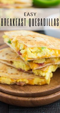 These Easy Breakfast Quesadillas are filled with fluffy, scrambled eggs, green peppers, bacon and cheddar cheeses, all enveloped between two crispy tortilla shells. It's an easy meal that's perfect for busy mornings!#quesadillas #breakfastquesadilla #eggs #breakfast #quesadillarecipes #easybreakfast #recipe