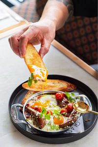 Creamy burrata, paired with eggs, sausages, fresh tomatoes and basil. Inquire about our food photography services to discover how we can help your hospitality brand stand out with high-quality visuals. Click the pin to see more of our work!