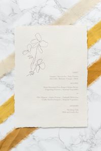 Organic, romantic flower sketch menu on handmade paper for a boho wedding