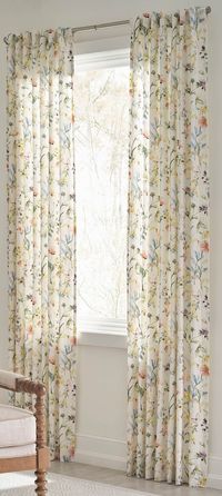 The allen+roth Sommers window panel is a whimsical multi color floral print on a dry cotton and linen fabric with a subtle texture. allen + roth 84-in Floral Print Light Filtering Back Tab Single Curtain Panel Cotton | X852.01584ZBG