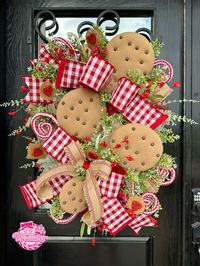 Chocolate chip cookie wreath made by Wreaths by Waldo. Features designer ribbons, handmade chocolate chip cookies + more!