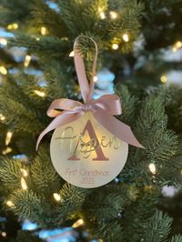 The last day to order for delivery by 12/24 to the continental US is 12/6. This beautiful acrylic ornament comes personalized with baby's first initial engraved on it with her name cut of 1/8" gold mirror acrylic for a 3d look standing off the backer. It makes the perfect addition to any Christmas tree to commemorate baby's first Christmas. Each ornament is laser engraved on beautiful frosted acrylic with a laser cut name placed atop the backer. Each ornament measures 4" in diameter and 1/8" thi