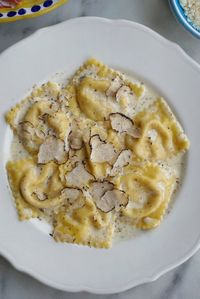 Prosciutto Ravioli in a Black Truffle & Parmesan Cream Sauce