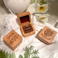 DETAILS • Elevate your special moments with our exquisite Customised Solid Oak Wooden Ring Box, meticulously crafted for longevity and charm. • Looking for the perfect ring box to accompany your milestone moments? Our personalised ring box adds a unique touch to your proposal, wedding ceremony, or as a heartfelt gift for Valentine's Day or anniversaries. • Each of our beautifully engraved Bearer Ring Holders is made to order, ensuring a bespoke addition to your celebration. Choose from a wide se