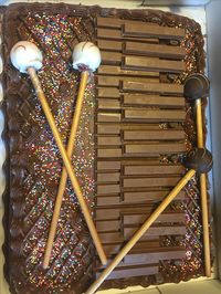 Marimba cake! Used a store bought cake. Used KitKat bars for marimba bars and used cake pops for mallets.