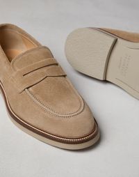 Suede penny loafers The timeless casual allure of Penny Loafers is enriched with refined Brunello Cucinelli materials. The velvety hand of suede is combined with a lightweight construction and a leather and rubber sole to ensure comfort and versatility.