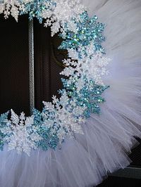 A little inexpensive white tulle and some Dollar Tree glittery snowflakes and... Voila! Winter wreath! - Click image to find more DIY